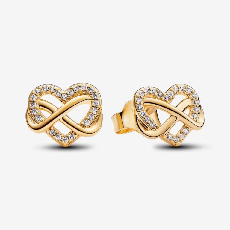 Pair of gold heart-shaped stud earrings with an infinity design and clear stone accents.